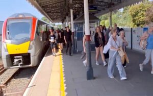 train passenger arrivals pouring into town